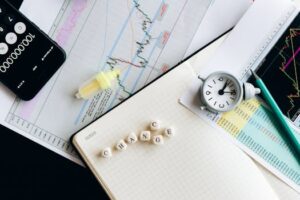 Top view of financial documents with charts, calculator, clock, and the word 'Change' in focus.